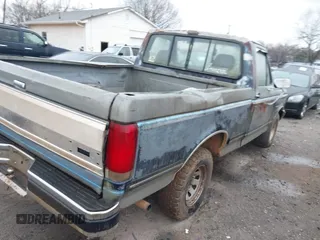 1990 Ford F-150 "S" with VIN 1FTDF15Y4LNB46798, listed as a IAAI auction lot 41767651 with 578,470 mi miles. Bid and sale history available at carsss.com. Image 4.