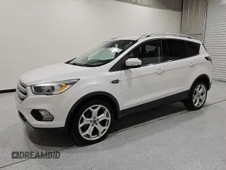 2018 Ford Escape Titanium с VIN 1FMCU9J90JUC67390, выставлен на аукционе Copart как лот 64271865 с пробегом 79 921 миль миль и Чистый • Clean title. История ставок и продаж доступна на DreamBid. Изображение 1.