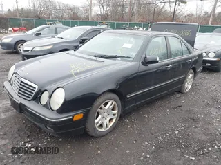 2002 Mercedes-Benz E-Class with VIN WDBJF82J52X064244, listed as a IAAI auction lot 41819863 with 999,999 mi miles. Bid and sale history available at carsss.com. Image 2.
