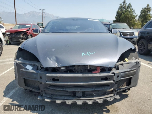 2014 Tesla Model S 60 z VIN 5YJSA1H11EFP64764, wystawiony jako Copart lot #64265815 z przebiegiem 126 191 mil mil oraz Szkoda całkowita • Salvage title. Historia ofert i sprzedaży dostępna na DreamBid. Obrazek 5.
