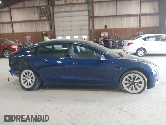 2022 Tesla Model 3 Long Range with VIN 5YJ3E1EB8NF255163, listed as a IAAI auction lot 42105451 with 40,166 mi miles and . Bid and sale history available at DreamBid. Image 13.