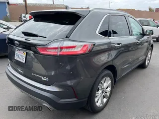 2020 Ford Edge Titanium z VIN 2FMPK4K96LBA73836, wystawiony jako IAAI lot #42218982 z przebiegiem 66 968 mil mil oraz . Historia ofert i sprzedaży dostępna na DreamBid. Obrazek 1.