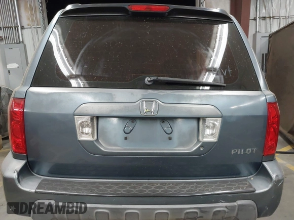 2005 Honda Pilot LX z VIN 2HKYF18135H537704, wystawiony jako IAAI lot #41091540 z przebiegiem Nie podano mil oraz . Historia ofert i sprzedaży dostępna na DreamBid. Obrazek 17.