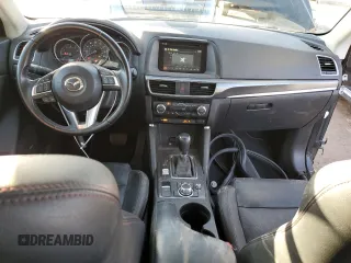 2016 Mazda CX-5 Grand Touring with VIN JM3KE4DY0G0731384, listed as a Copart auction lot 44741695 with 58,727 mi miles and Salvage Title. Bid and sale history available at carsss.com. Image 8.
