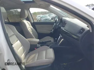 2014 Mazda CX-5 Grand Touring with VIN JM3KE4DY0E0343777, listed as a IAAI auction lot 41464395 with 126,214 mi miles. Bid and sale history available at carsss.com. Image 5.