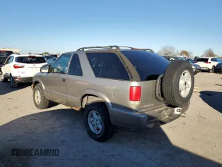 1999 Chevrolet Blazer LS с VIN 1GNCT18W1XK140616, выставлен на аукционе Copart как лот 78567434 с пробегом 244 356 миль миль и Чистый • Clean title. История ставок и продаж доступна на DreamBid. Изображение 2.