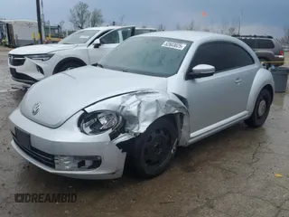 2012 Volkswagen Beetle 2.5L PZEV with VIN 3VWJP7AT7CM633823, listed as a Copart auction lot 52603025 with 117,603 mi miles and Salvage title. Bid and sale history available at DreamBid. Image 1.
