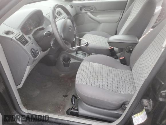 2005 Ford Focus S with VIN 1FAFP34N45W285454, listed as a Copart auction lot 59043485 with 165,071 mi miles and Salvage title. Bid and sale history available at DreamBid. Image 7.