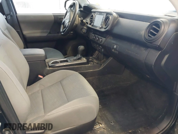 2023 Toyota Tacoma SR with VIN 3TYRX5GN2PT069110, listed as a IAAI auction lot 41235858 with 60,019 mi miles and . Bid and sale history available at DreamBid. Image 5.
