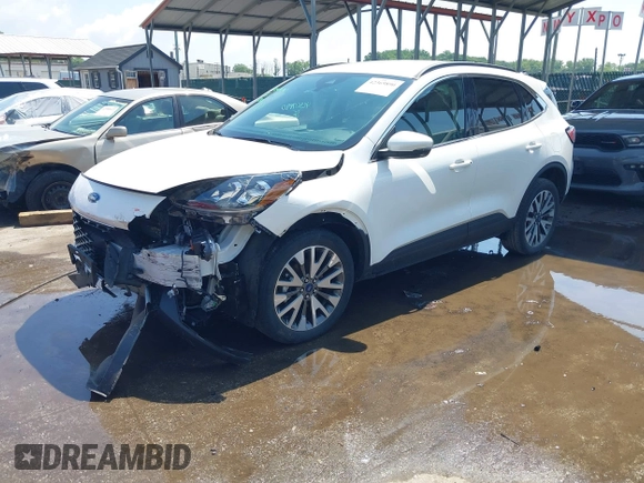 2020 Ford Escape Titanium z VIN 1FMCU9J90LUA39747, wystawiony jako IAAI lot #42369890 z przebiegiem 31 425 mil mil oraz . Historia ofert i sprzedaży dostępna na DreamBid. Obrazek 19.