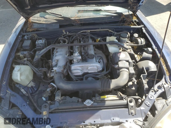 2002 Mazda MX-5 Miata Cloth z VIN JM1NB353220222868, wystawiony jako Copart lot #59944345 z przebiegiem 159 595 mil mil oraz Szkoda całkowita • Salvage title. Historia ofert i sprzedaży dostępna na DreamBid. Obrazek 11.