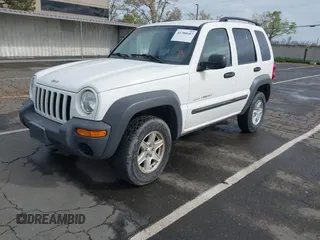 2002 Jeep Liberty Sport with VIN 1J4GL48K92W268896, listed as a IAAI auction lot 41915144 with 102,706 mi miles. Bid and sale history available at carsss.com. Image 2.