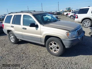 2001 Jeep Grand Cherokee Laredo with VIN 1J4GW48S11C519210, listed as a IAAI auction lot 42093631 with 211,024 mi miles. Bid and sale history available at carsss.com. Image 1.