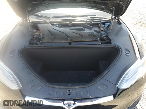 2019 Tesla Model S 100D with VIN 5YJSA1E42KF331240, listed as a Copart auction lot 54713975 with 43,940 mi miles and Salvage title. Bid and sale history available at DreamBid. Image 12.