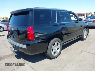 2015 Chevrolet Tahoe LTZ z VIN 1GNSKCKC7FR715512, wystawiony jako IAAI lot #42054583 z przebiegiem 106 941 mil mil oraz . Historia ofert i sprzedaży dostępna na DreamBid. Obrazek 4.