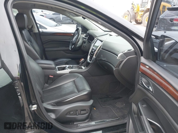 2015 Cadillac SRX Premium Collection z VIN 3GYFNDE3XFS576695, wystawiony jako IAAI lot #41612836 z przebiegiem Nie podano mil oraz . Historia ofert i sprzedaży dostępna na DreamBid. Obrazek 5.