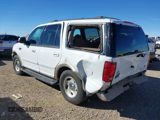 1999 Ford Expedition XLT z VIN 1FMPU18L2XLB77547, wystawiony jako IAAI lot #41161721 z przebiegiem 205 649 mil mil oraz . Historia ofert i sprzedaży dostępna na DreamBid. Obrazek 3.