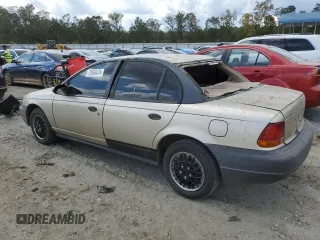 1999 Saturn SL z VIN 1G8ZH5280XZ178863, wystawiony jako Copart lot #73660474 z przebiegiem 195 738 mil mil oraz Szkody całkowita. Historia ofert i sprzedaży dostępna na DreamBid. Obrazek 2.