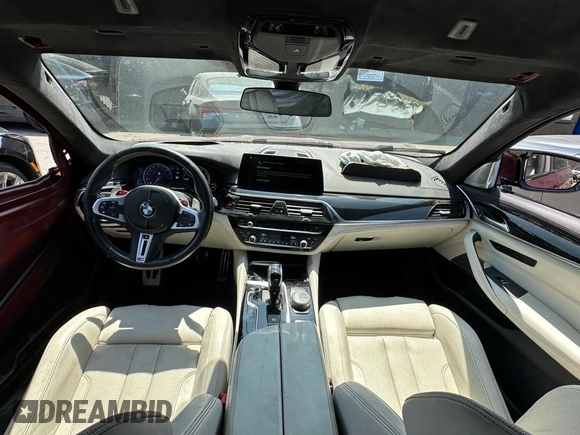 2018 BMW M5 z VIN WBSJF0C55JB283553, wystawiony jako Copart lot #55519235 z przebiegiem 57 128 mil mil oraz Szkody całkowita. Historia ofert i sprzedaży dostępna na DreamBid. Obrazek 9.
