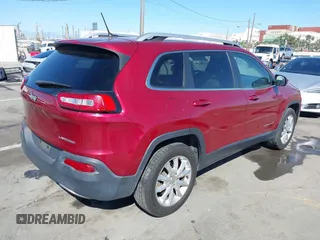 2015 Jeep Cherokee Limited with VIN 1C4PJMDB1FW599205, listed as a IAAI auction lot 41709308 with 112,415 mi miles. Bid and sale history available at carsss.com. Image 4.