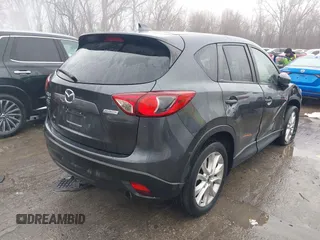 2014 Mazda CX-5 Grand Touring with VIN JM3KE4DY0E0392476, listed as a IAAI auction lot 41419144 with 89,245 mi miles and . Bid and sale history available at carsss.com. Image 4.