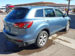 2014 Mazda CX-9 Sport with VIN JM3TB3BA5E0427753, listed as a IAAI auction lot 41679267 with 135,993 mi miles and . Bid and sale history available at DreamBid. Image 4.