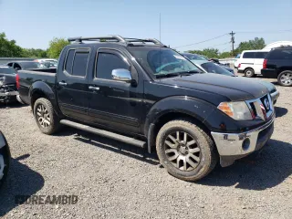 2010 Nissan Frontier Pro-4X with VIN 1N6AD0EV1AC447205, listed as a Copart auction lot 62007355 with 128,371 mi miles and Clean title. Bid and sale history available at DreamBid. Image 4.