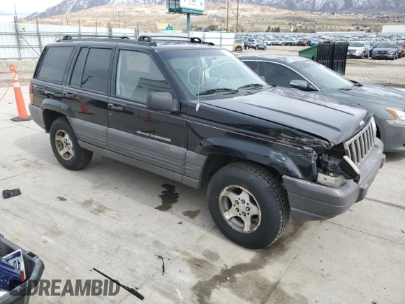 1996 Jeep Grand Cherokee with VIN 1J4EZ58S8TC106529, listed as a Copart auction lot 50163965 with 226,951 mi miles and Salvage title. Bid and sale history available at DreamBid. Image 4.