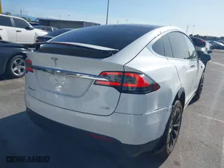 2018 Tesla Model X 75D with VIN 5YJXCAE23JF136499, listed as a IAAI auction lot 41934857 with 83,752 mi miles. Bid and sale history available at carsss.com. Image 4.