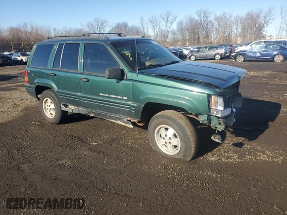 1998 Jeep Grand Cherokee Laredo with VIN 1J4GZ48S4WC239246, listed as a Copart auction lot 86101204 with 0 mi miles and Salvage Title. Bid and sale history available at carsss.com. Image 4.