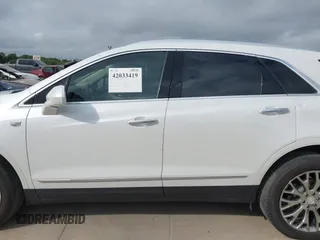 2017 Cadillac XT5 Luxury FWD z VIN 1GYKNBRS3HZ195197, wystawiony jako IAAI lot #42033419 z przebiegiem 76 709 mil mil oraz . Historia ofert i sprzedaży dostępna na DreamBid. Obrazek 14.