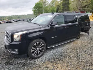 2017 GMC Yukon XL SLT with VIN 1GKS1GKC5HR332484, listed as a Copart auction lot 51957095 with 188,204 mi miles and Salvage Title. Bid and sale history available at DreamBid. Image 1.