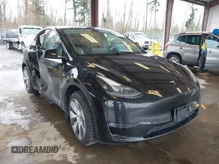 2023 Tesla Model Y Long Range with VIN 7SAYGAEE7PF739924, listed as a IAAI auction lot 41612323 with 75,226 mi miles and . Bid and sale history available at DreamBid. Image 1.