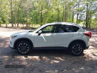 2016 Mazda CX-5 Grand Touring with VIN JM3KE2DY0G0870077, listed as a IAAI auction lot 42158225 with 93,816 mi miles. Bid and sale history available at carsss.com. Image 14.