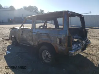 1986 Ford Bronco z VIN 1FMCU14TXGUD18203, wystawiony jako Copart lot #47194155 z przebiegiem Nie podano mil oraz Czysty tytuł • Clean title. Historia ofert i sprzedaży dostępna na DreamBid. Obrazek 2.