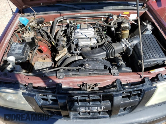 2003 Isuzu Rodeo with VIN 4S2CK58W634301712, listed as a Copart auction lot 76727514 with 192,830 mi miles and Salvage Title. Bid and sale history available at DreamBid. Image 12.