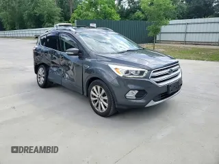 2018 Ford Escape Titanium with VIN 1FMCU0J93JUB20136, listed as a Copart auction lot 56841065 with 129,954 mi miles and Salvage title. Bid and sale history available at DreamBid. Image 14.