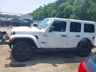 2021 Jeep Wrangler Unlimited Sahara with VIN 1C4HJXEN1MW618508, listed as a IAAI auction lot 42639515 with 39,747 mi miles and . Bid and sale history available at DreamBid. Image 14.
