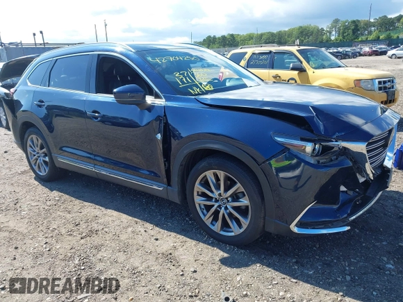 2019 Mazda CX-9 Grand Touring with VIN JM3TCBDY6K0335886, listed as a IAAI auction lot 42704250 with 37,171 mi miles and . Bid and sale history available at DreamBid. Image 1.