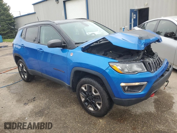 2018 Jeep Compass Trailhawk with VIN 3C4NJDDBXJT139496, listed as a Copart auction lot 57068265 with 105,809 mi miles and Salvage title. Bid and sale history available at DreamBid. Image 4.