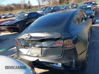 2020 Tesla Model 3 Standard Range Plus with VIN 5YJ3E1EA4LF745491, listed as a IAAI auction lot 41186726 with 74,575 mi miles and . Bid and sale history available at DreamBid. Image 6.