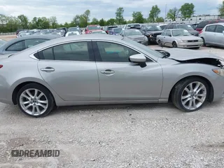 2014 Mazda 6 i Touring with VIN JM1GJ1T51E1106970, listed as a IAAI auction lot 42027350 with 113,756 mi miles and . Bid and sale history available at DreamBid. Image 13.