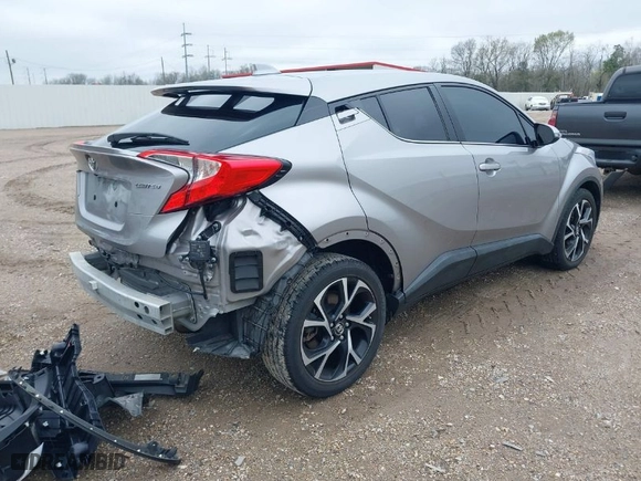 2019 Toyota C-HR XLE with VIN NMTKHMBX0KR082023, listed as a IAAI auction lot 41606867 with 52,814 mi miles. Bid and sale history available at carsss.com. Image 4.