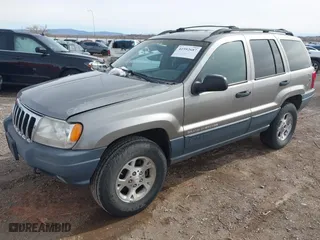 1999 Jeep Grand Cherokee Laredo with VIN 1J4GW58S6XC613307, listed as a IAAI auction lot 41592687 with 264,176 mi miles. Bid and sale history available at carsss.com. Image 2.