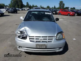2005 Hyundai Accent GLS with VIN KMHCG45C55U623340, listed as a Copart auction lot 59587304 with 275,364 mi miles and Salvage Title. Bid and sale history available at carsss.com. Image 5.