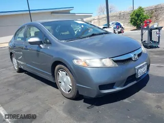 2010 Honda Civic Hybrid with VIN JHMFA3F29AS005350, listed as a IAAI auction lot 41966454 with 145,058 mi miles. Bid and sale history available at carsss.com. Image 1.