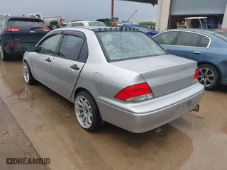 2003 Mitsubishi Lancer ES with VIN JA3AJ26E43U038813, listed as a IAAI auction lot 41778956 with 150,764 mi miles. Bid and sale history available at carsss.com. Image 3.