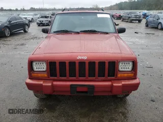 1999 Jeep Cherokee Sport with VIN 1J4FT68S1XL601799, listed as a Copart auction lot 83881844 with 203,572 mi miles and Salvage title. Bid and sale history available at DreamBid. Image 5.