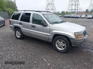 2004 Jeep Grand Cherokee Laredo with VIN 1J4GW48N34C145956, listed as a IAAI auction lot 42201114 with 137,815 mi miles and . Bid and sale history available at DreamBid. Image 1.