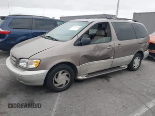 1998 Toyota Sienna LE with VIN 4T3ZF13C4WU047568, listed as a IAAI auction lot 42062449 with 130,019 mi miles. Bid and sale history available at carsss.com. Image 2.